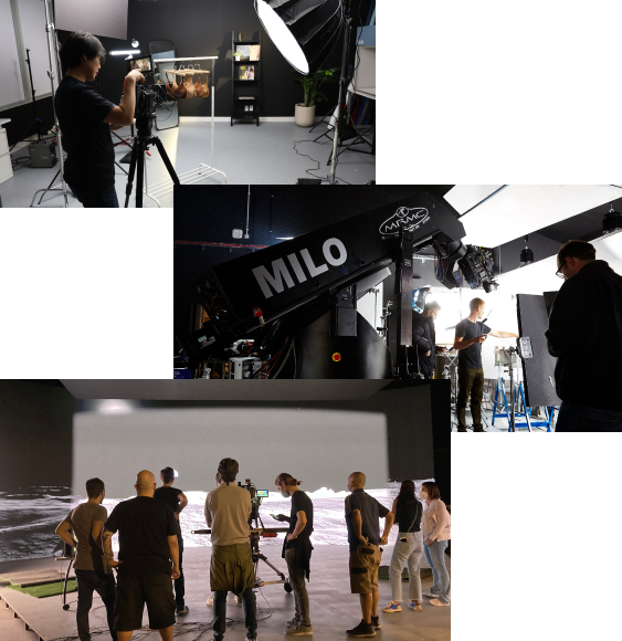 A cameraman is in a studio, filming a rack of brown bras. A large spotlight is positioned to the right.  A set is being filmed behind the scenes, with a large camera crane looming over it and the team working. A team of casually dressed individuals are seen from behind a film set.