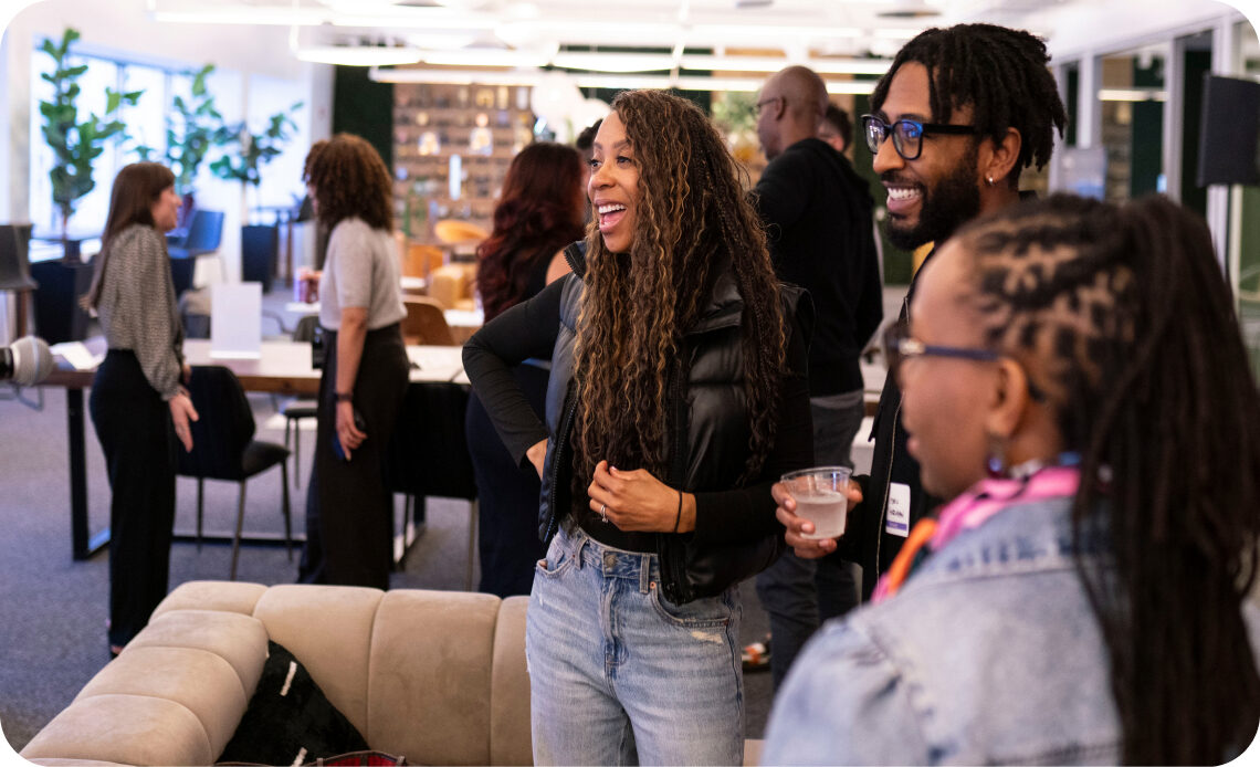 Omnicom colleagues networking in a bright modern office lounge